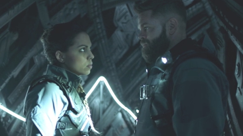 Chandra Wei, Amos Burton in dark tunnel The Expanse