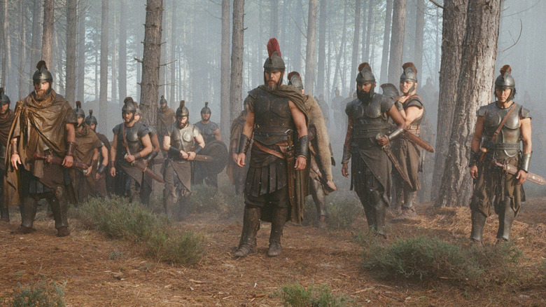 Odysseus with his men in a forest in "The Odyssey" (2026)