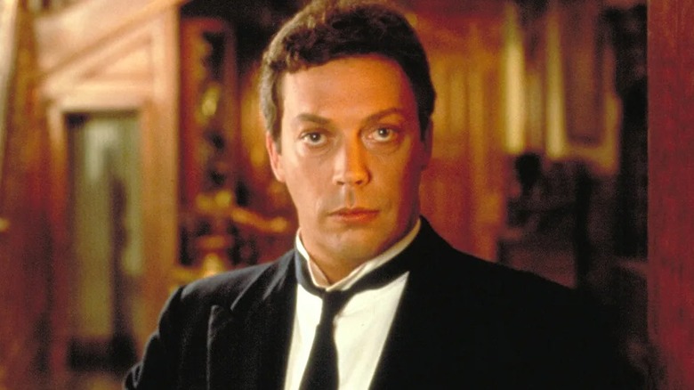 Wadsworth looking at door in Clue