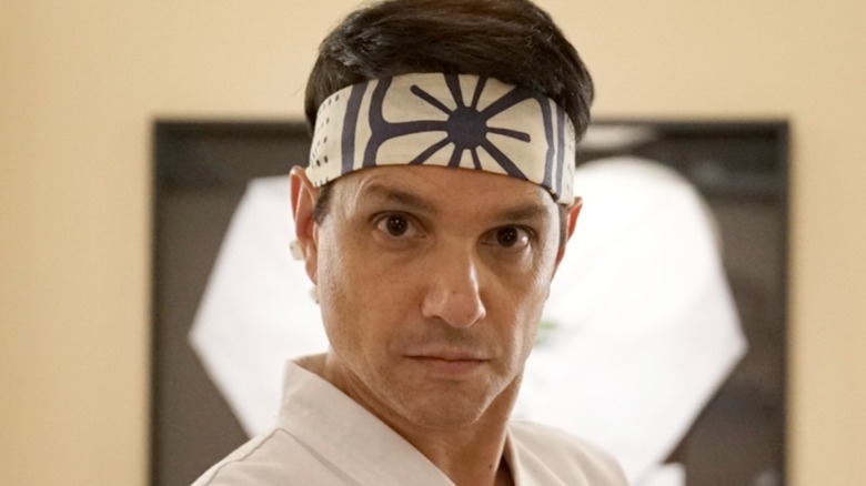 Daniel LaRusso in close-up wearing karate gi in Cobra Kai