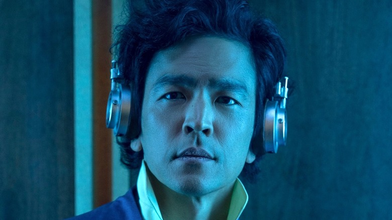 John Cho as Spike Spiegel wearing headphones