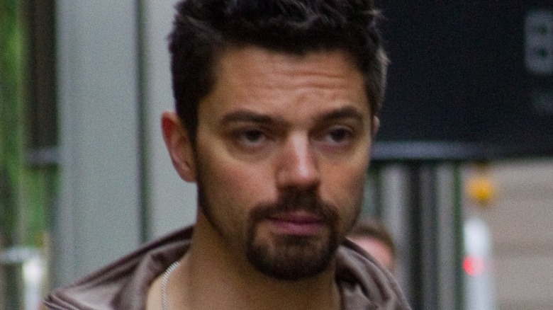 Dominic Cooper wearing a leather jacket