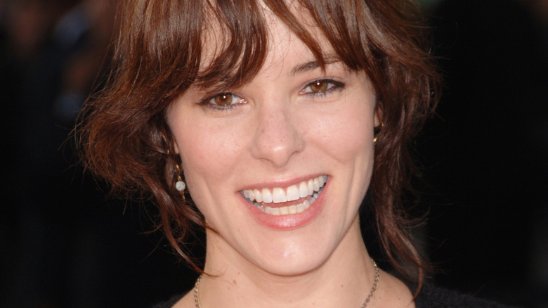 Parker Posey grinning
