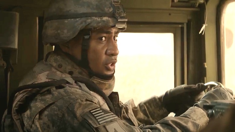Koale driving Humvee