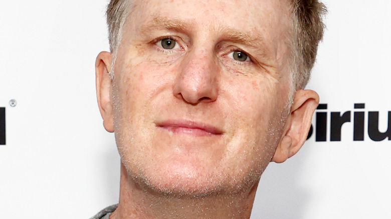 Michael Rapaport smiling into camera