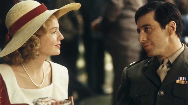 Kay Adams and Michael Corleone looking at each other at a family wedding in 