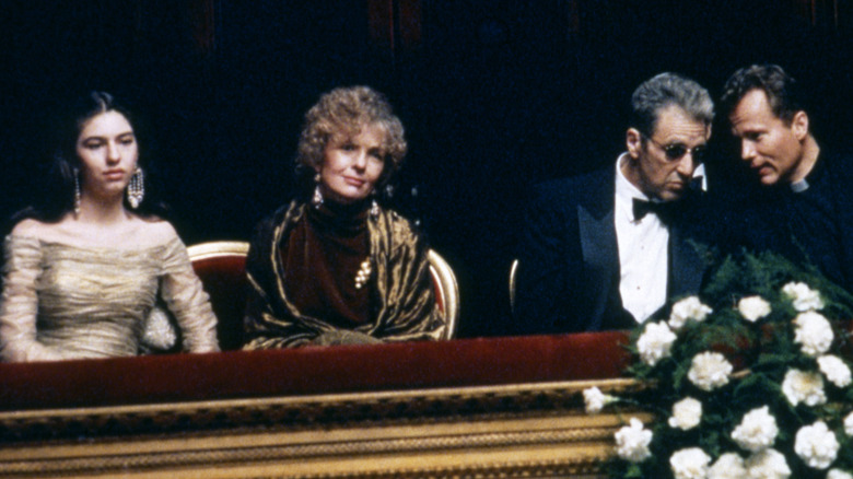 Mary, Kay, and Michael Corleone sitting in a box at the opera house in 