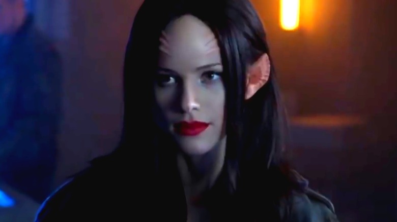 Alternate timeline Alara with long black hair and red lipstick