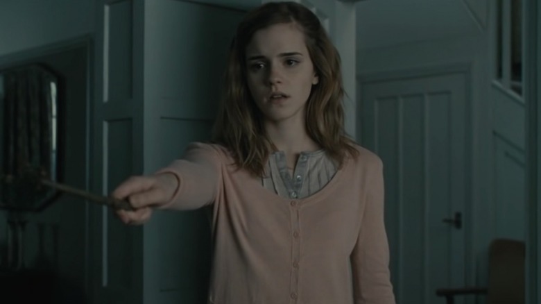 Hermione holding out her wand