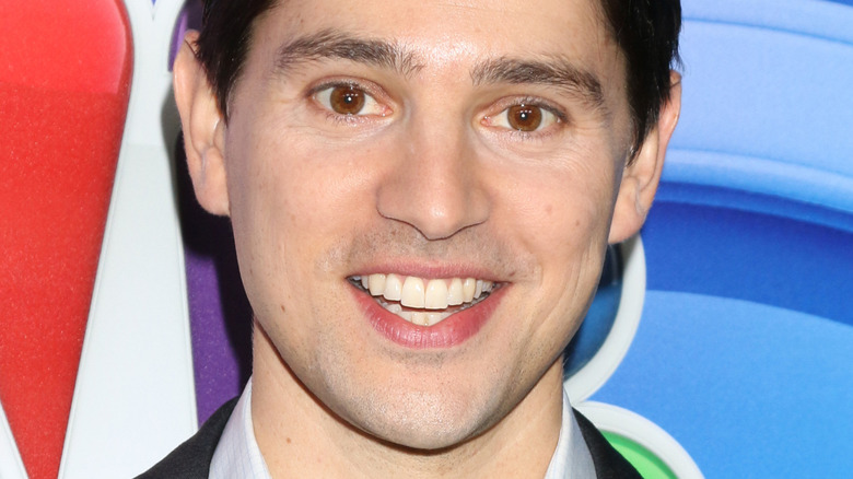 Nicholas D'Agosto smiling at an NBC event