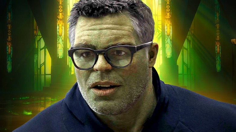 The Hulk wearing glasses and looking thoughtful against a green background