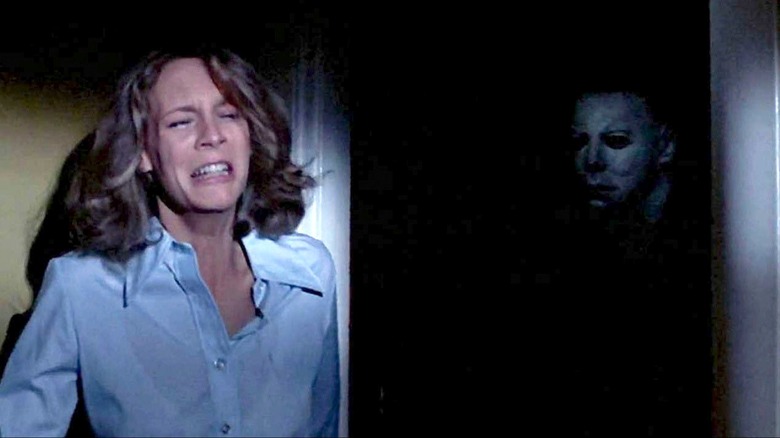 Laurie hiding from Michael Myers