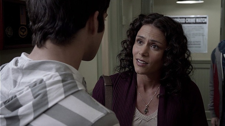 Melissa talking to Scott in the hallway