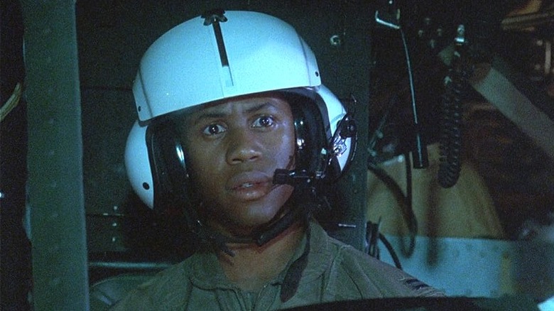 Derek Webster wearing a helicopter helmet with microphone
