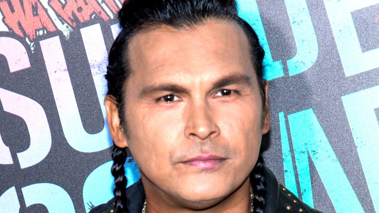 Adam Beach with braids