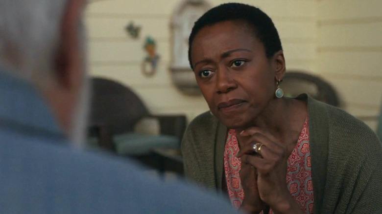 Barbara Eve Harris holding hands together