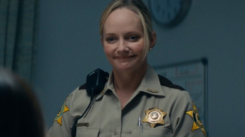 Judy smiling police uniform