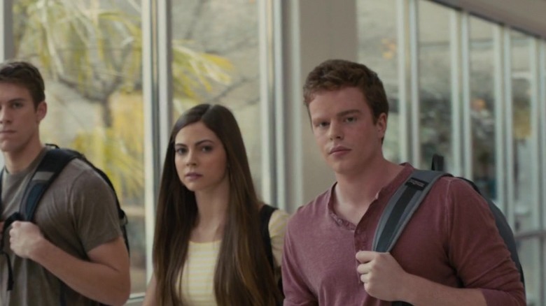 Becca Arrington and her friends walk down the hallway