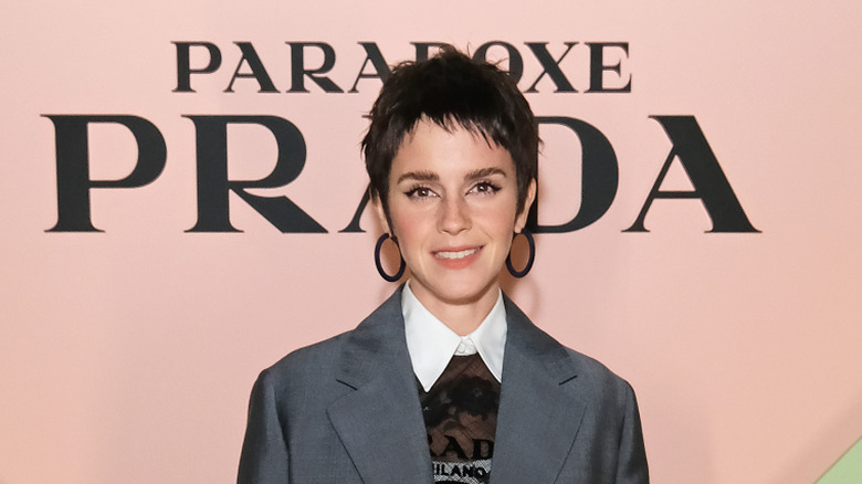 Emma Watson posing at a Prada Paradoxe event