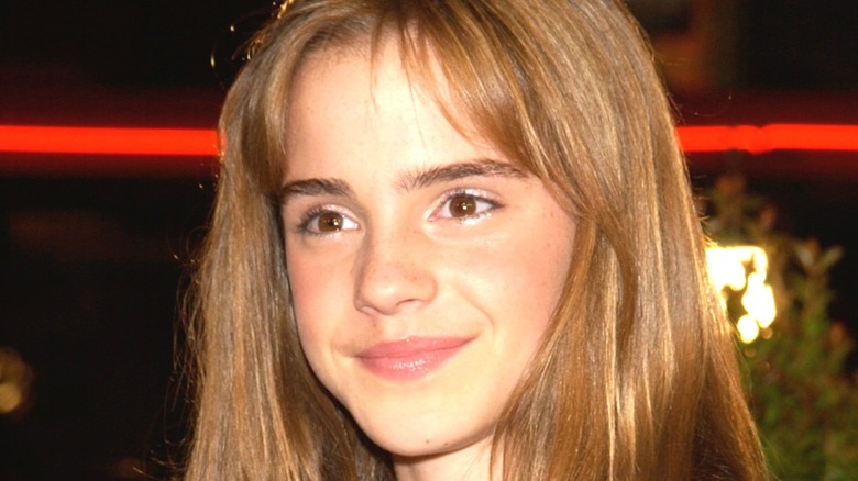 young Emma Watson smiling