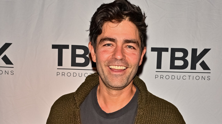 Adrian Grenier smiling at a TBK Productions events