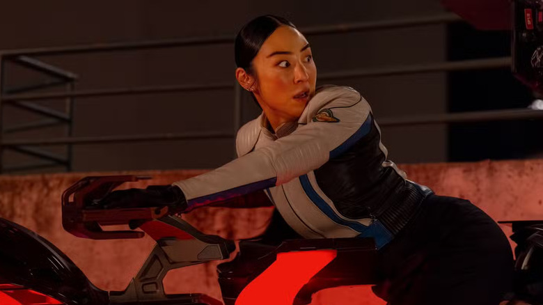 Eve riding a motorcycle in Tron: Ares