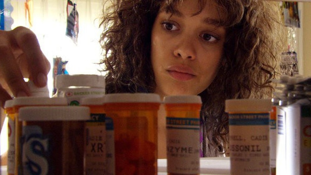 Cadie examines prescription pills