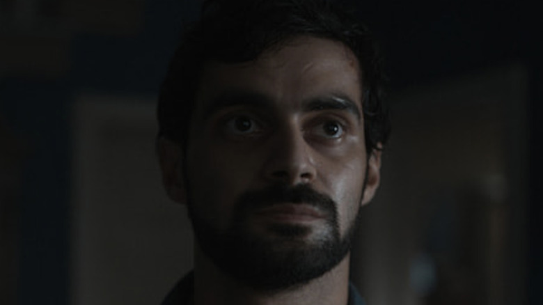 Firas Nassar looking serious in Invasion