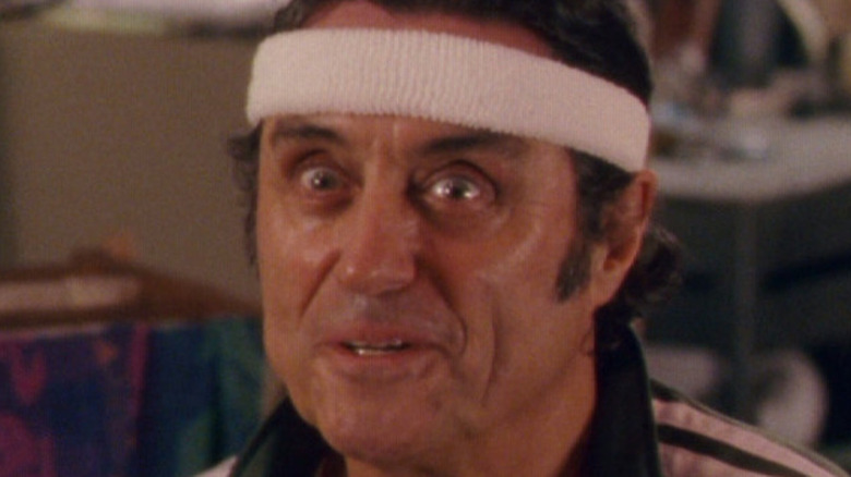 Ian McShane Frank Powell smiling headband