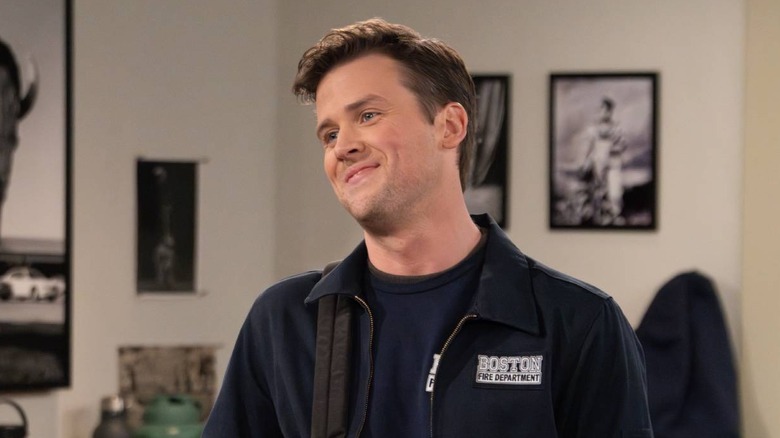 Freddy Crane smirking with a backpack