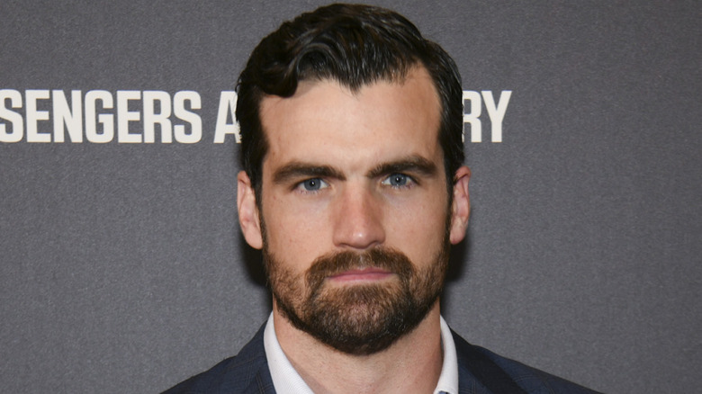 Caleb Alexander Smith smirking