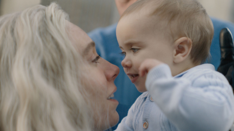 Sue and baby Franklin are face to face in "The Fantastic Four: First Steps" (2025)