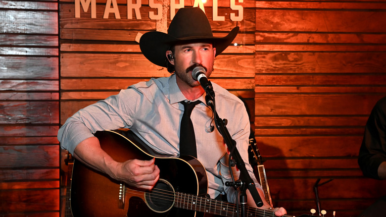 Riley Green singing at the "Marshals" premiere in 2026