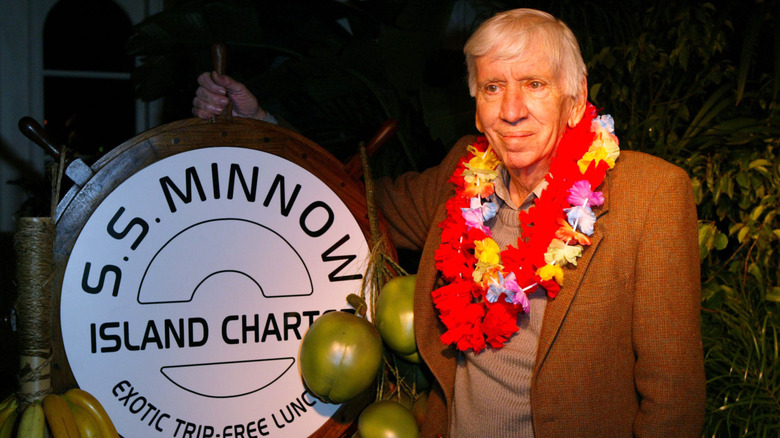 Bob Denver poses with a prop at a "Gilligan's Island" DVD release party