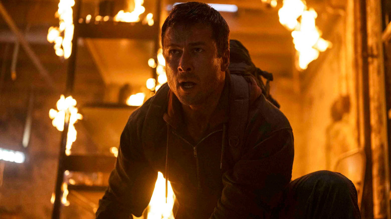 Ben Richards in a fiery situation in "The Running Man" (2025)