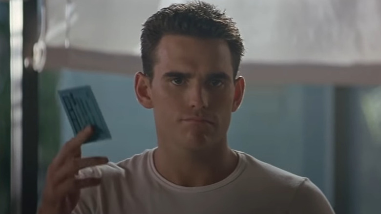 Sam Lombardo holding a coupon