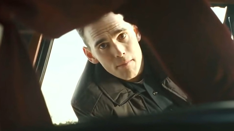 Officer Ryan looking into car
