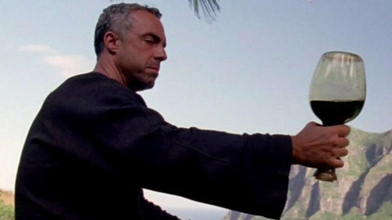 The Man in Black holding a glass