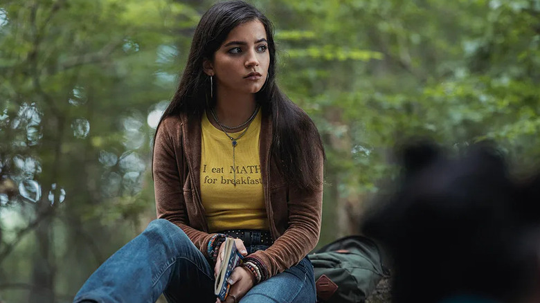 Anya wearing a shirt that says 'I eat math for breakfast' in the woods in Madame Web
