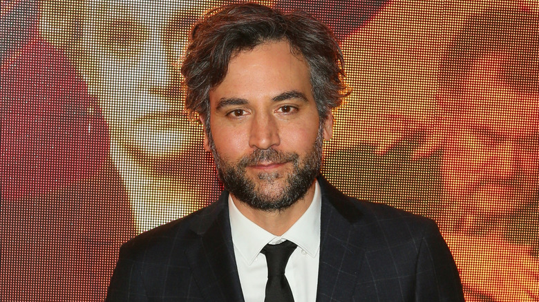 Josh Radnor posing at an even for Amazon's "Hunters"