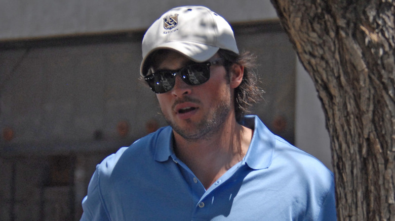 Tom Welling in sunglasses and a blue polo shirt
