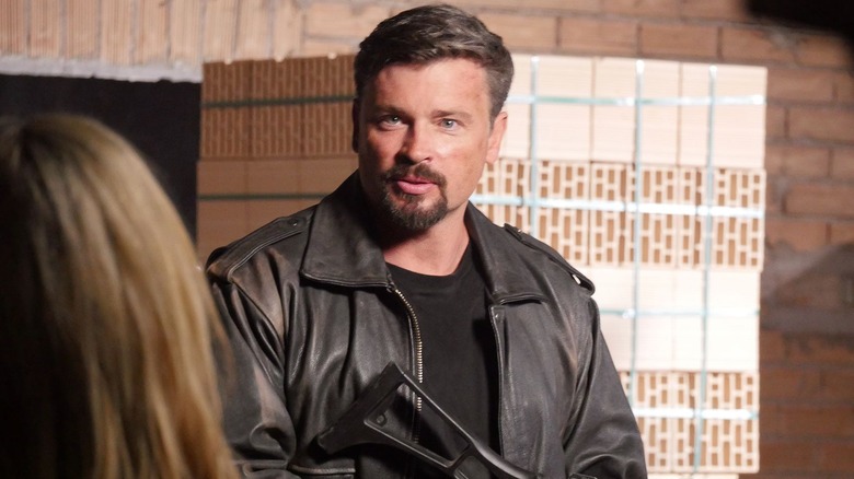 Terry holding a gun in "Mafia Wars" (2024)