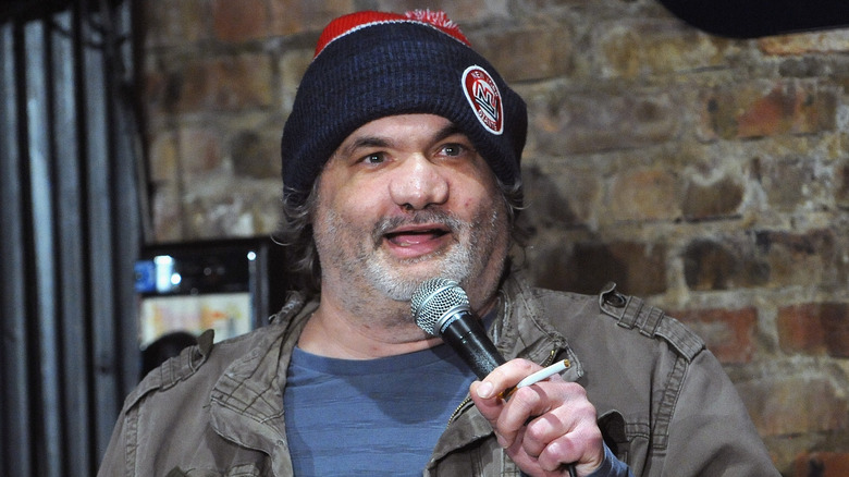 Artie Lange talking into microphone