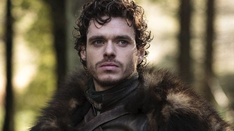 Richard Madden in front of trees in Game of Thrones
