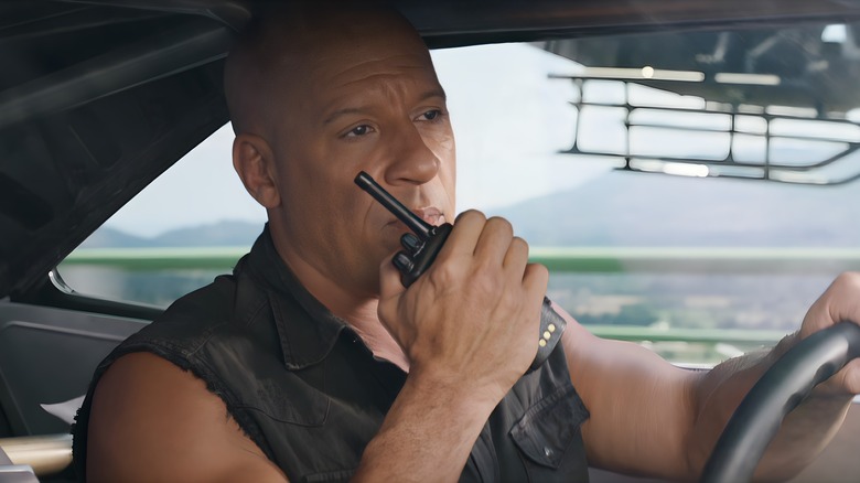 Dominic Toretto speaking into walkie-talkie 