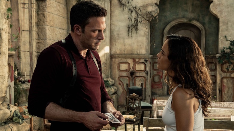 Detective Rourke and Diana talking in square