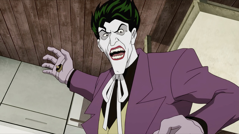 The Joker wearing purple suit and joke hand zapper