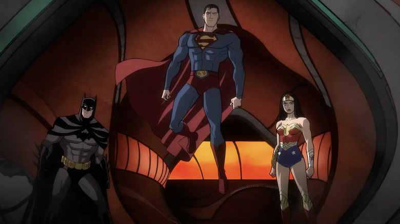 Superman floating between Batman and Wonder Woman