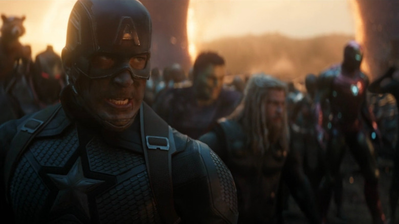 Captain America bearing his teeth with Thor, Hulk, and Iron Man in background in Avengers: Endgame