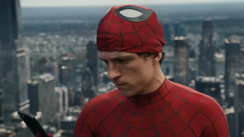 Peter Parker stares at his phone in "Spider-Man: Brand New Day"